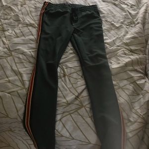 Green track pants